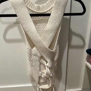 3.1 Phillip Lim white crocheted sleeveless top with cross cross detail on back.